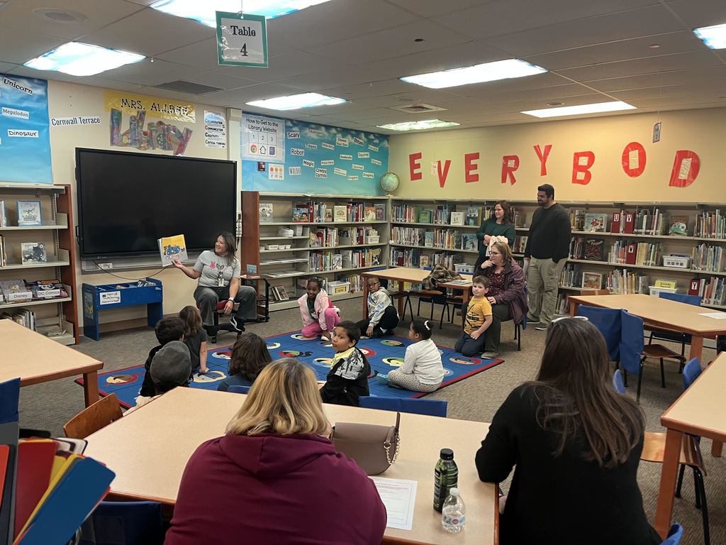 students listening to teacher read aloud