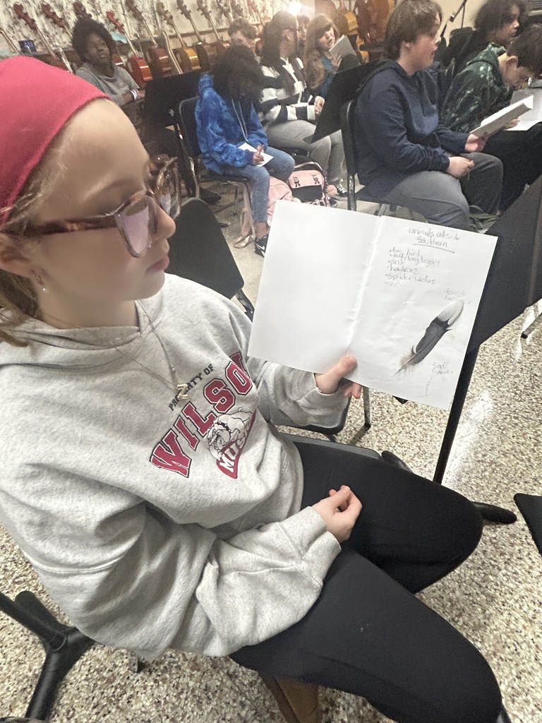 students showing journal