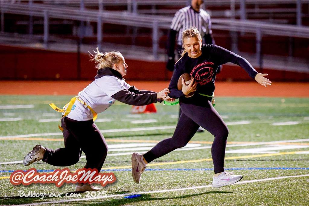 students running with ball