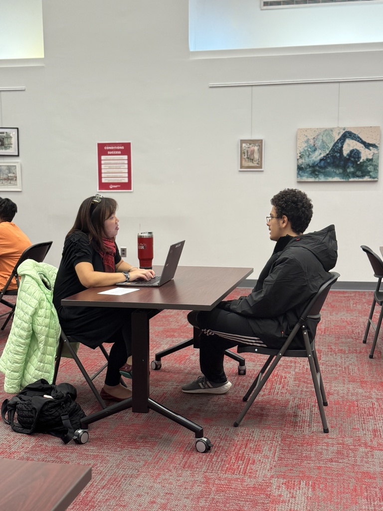 students talking with staff