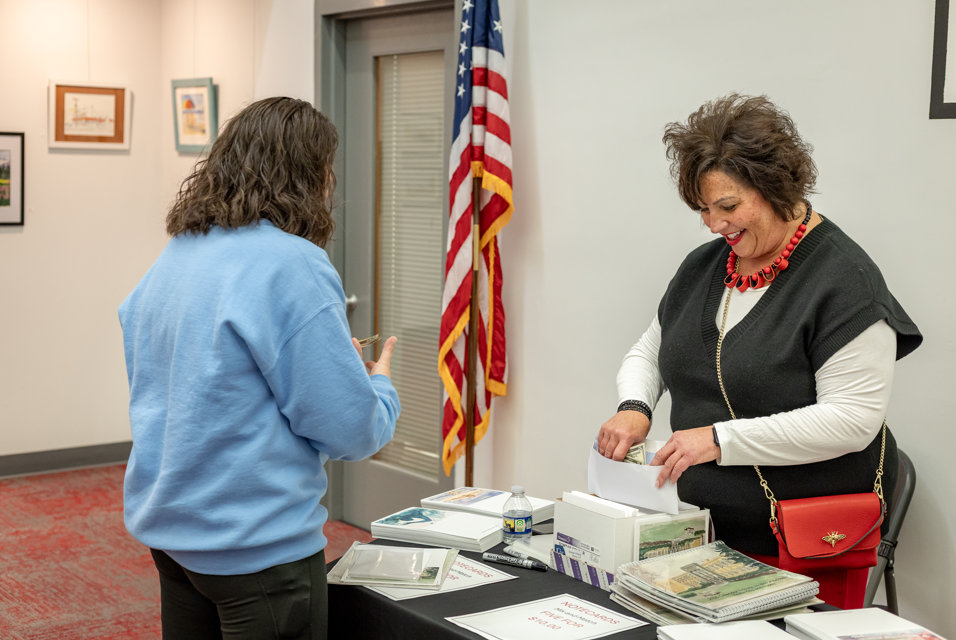women handling cash at front door