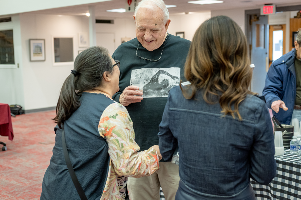 roy interacting with people attending