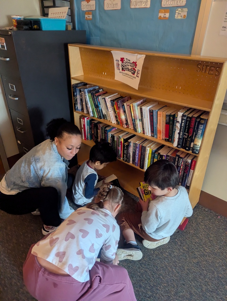 students looking at books