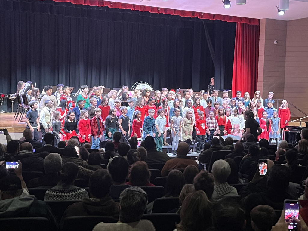 students singing on stage