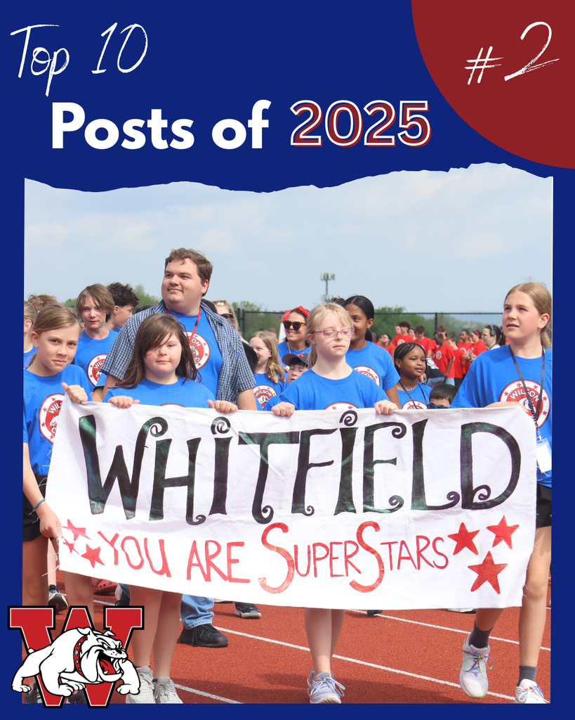 top 10 posts of 2025 #2 - students walking track holding up a sign that says whitfield you are super stars all wearing the same shirt
