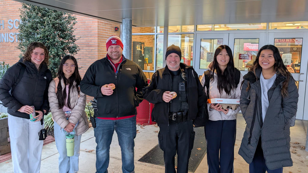 students with principal and officer johnson