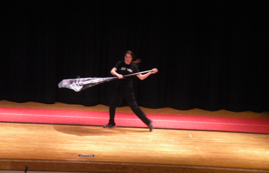 girl dancing with flag