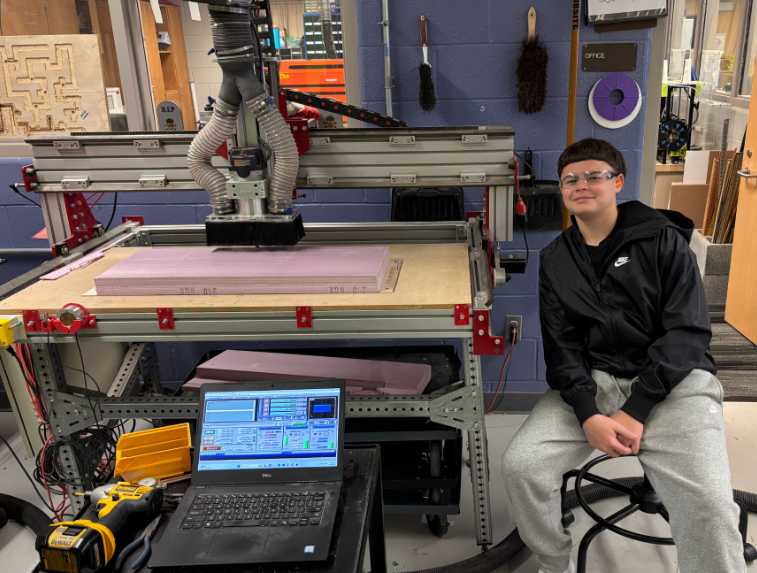 student next to machine