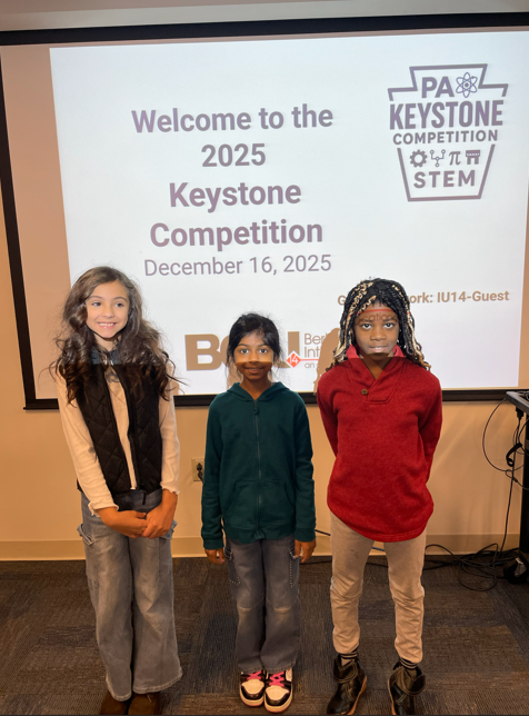 students in front of welcome sign