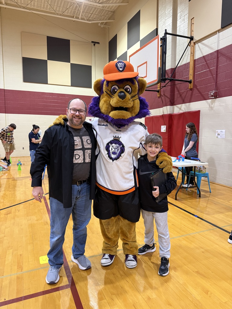 student and teacher with mascot slapshot