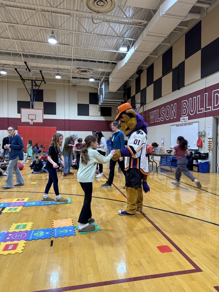 student with mascot slapshot