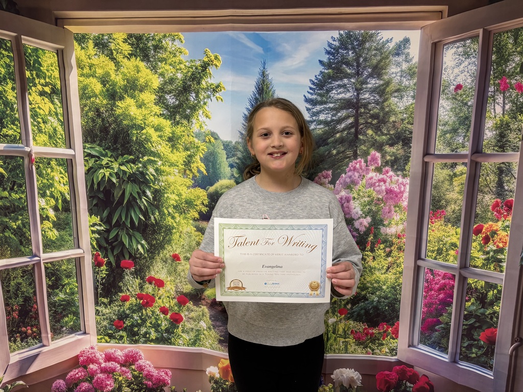 Student holding certificate