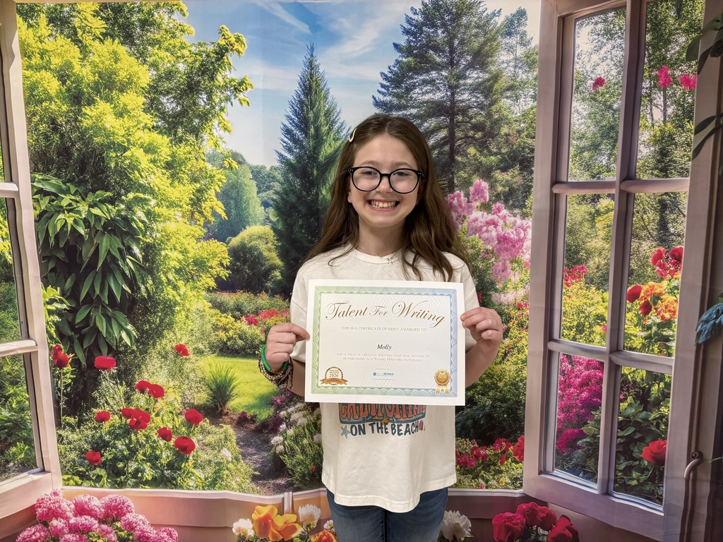 Student holding certificate