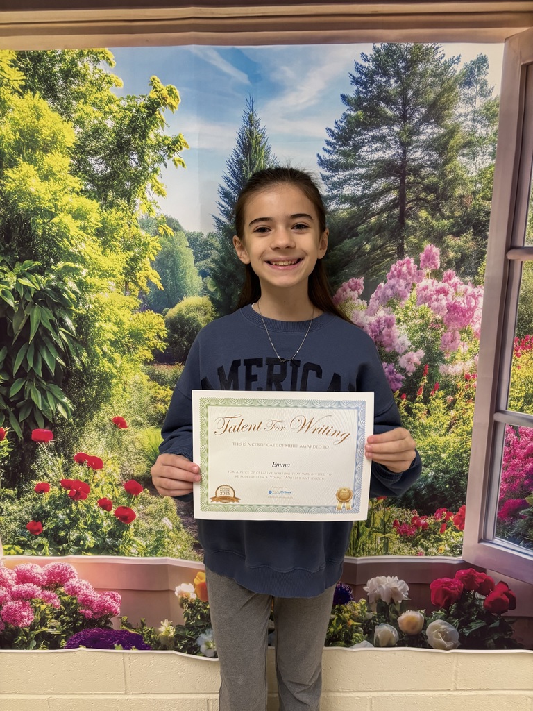 Student holding certificate