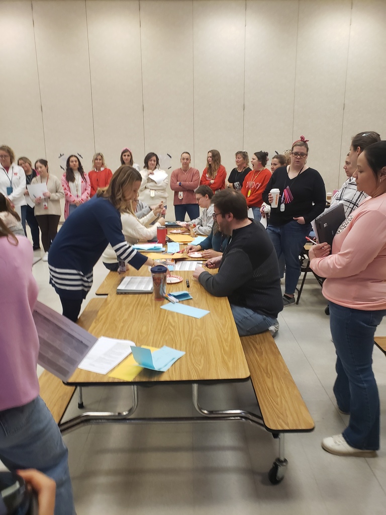 co workers working one to one with teachers around