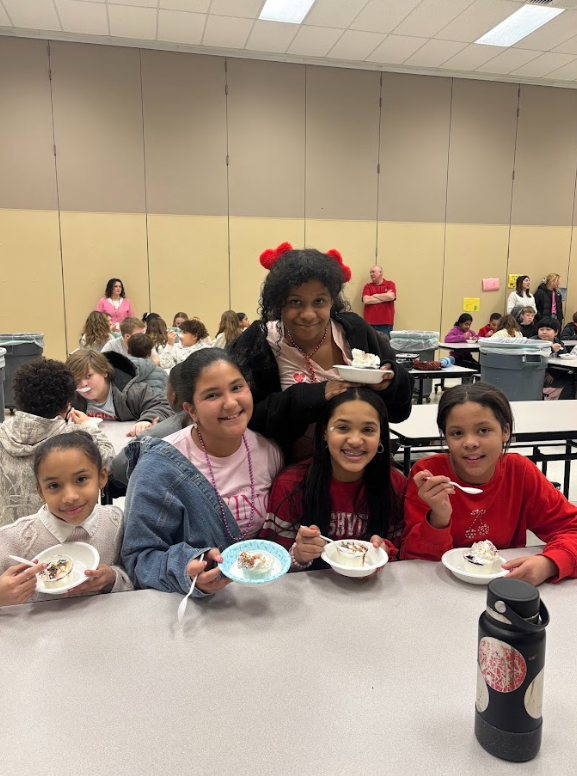students eating ice cream at lunch table