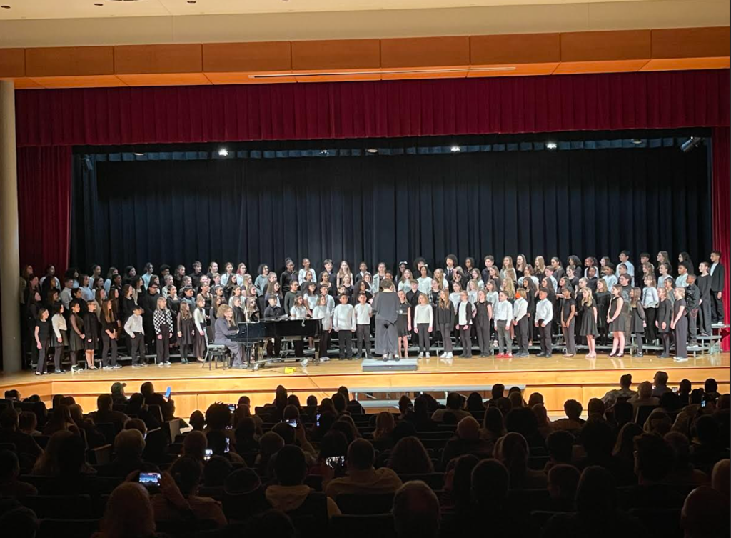 students performing on stage