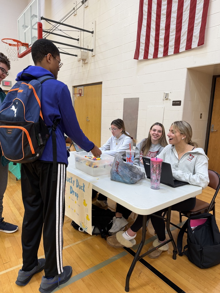 student interacting at lucky duck drop table
