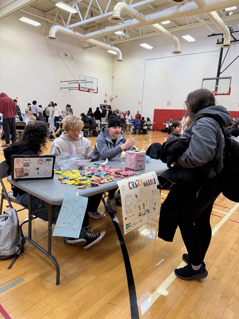 students interacting at crazy marble table