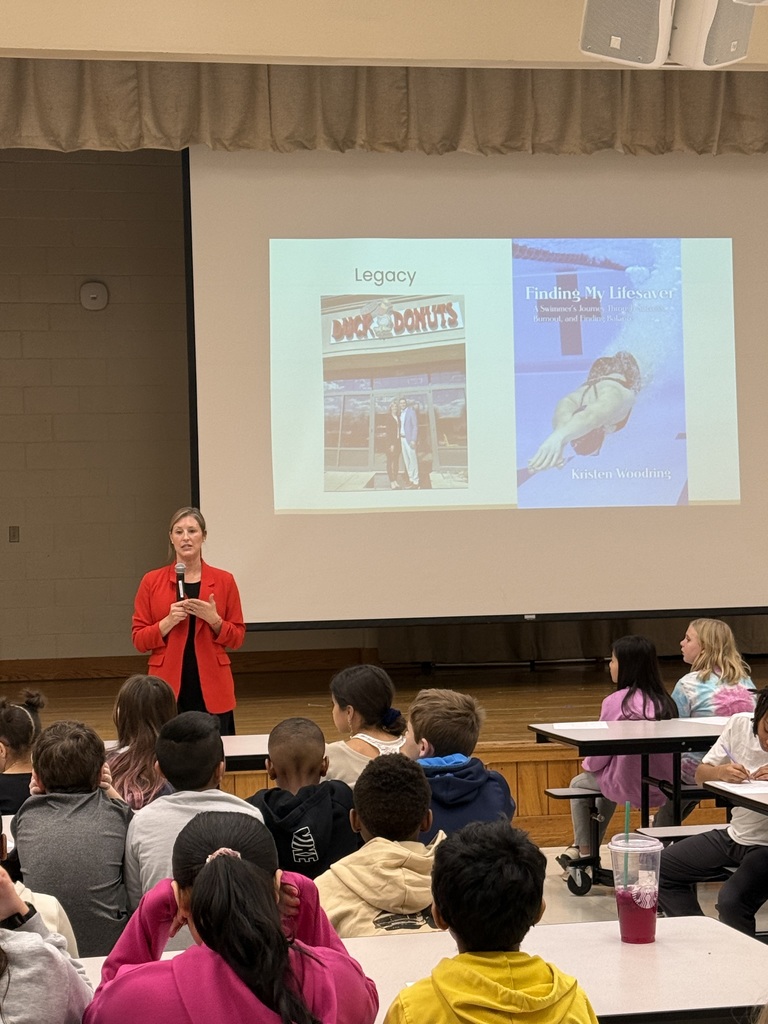 speaker talking to students in cafeteria