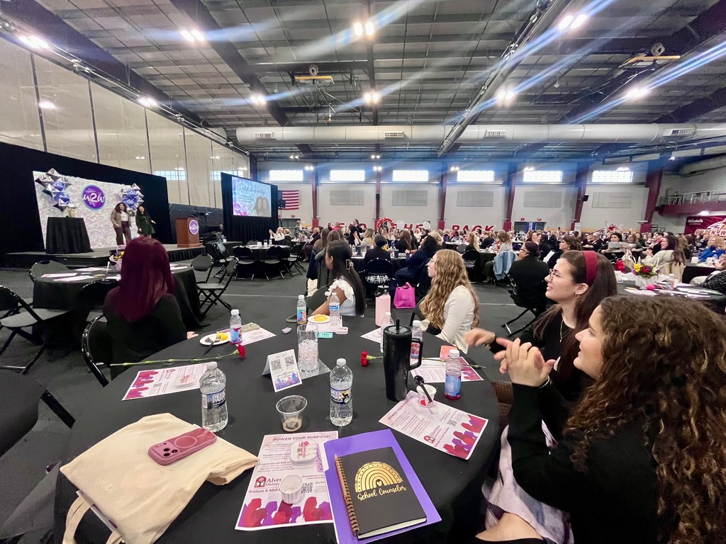 students listening to speaker at event