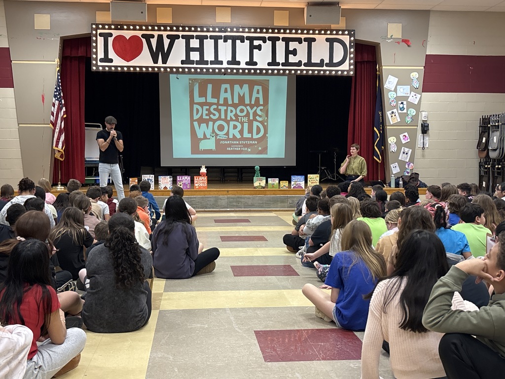 speakers talking to students on stage