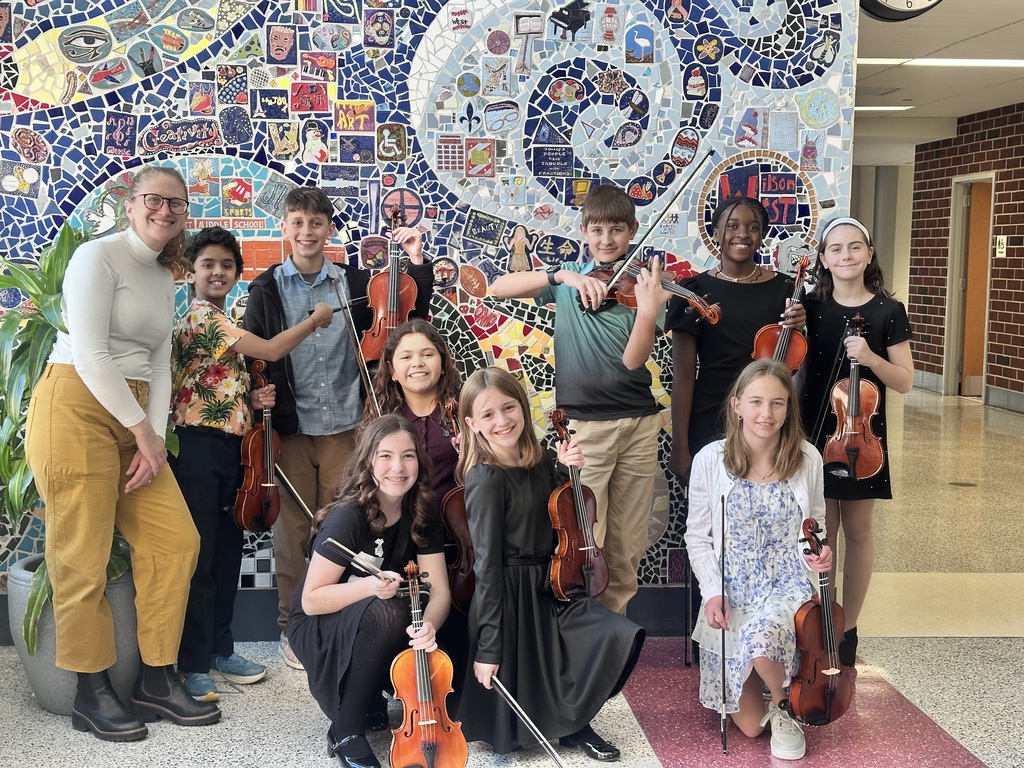 students and teacher with students and instruments