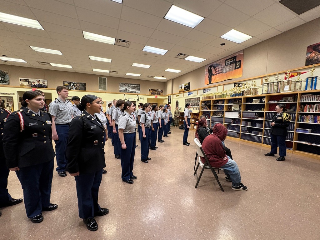 students in uniform standing in line