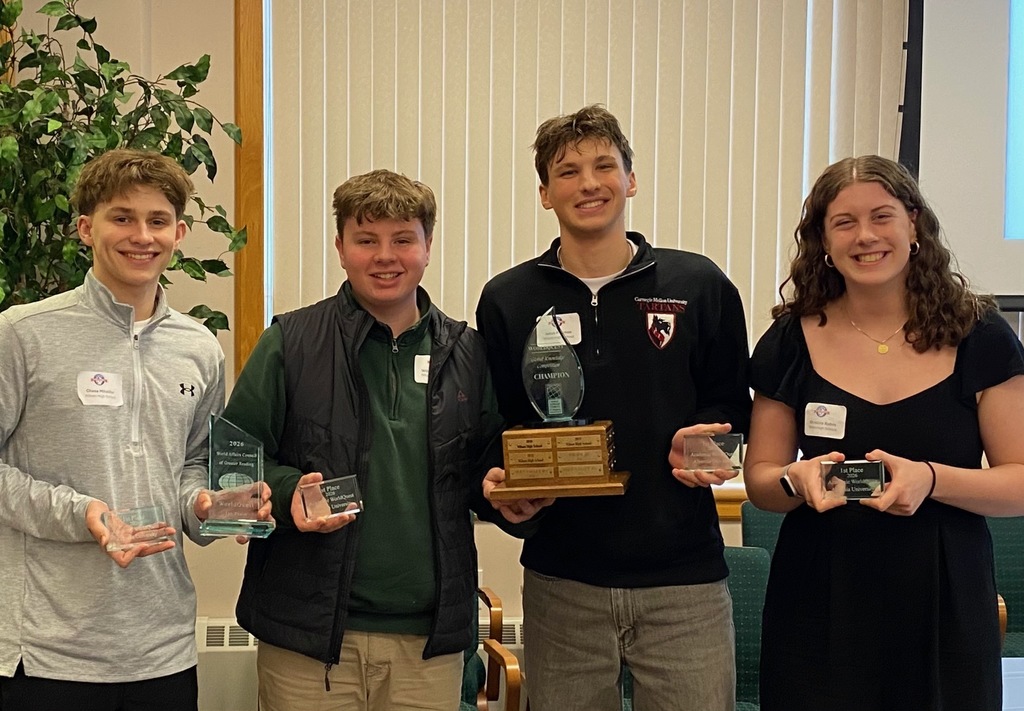 students holding awards
