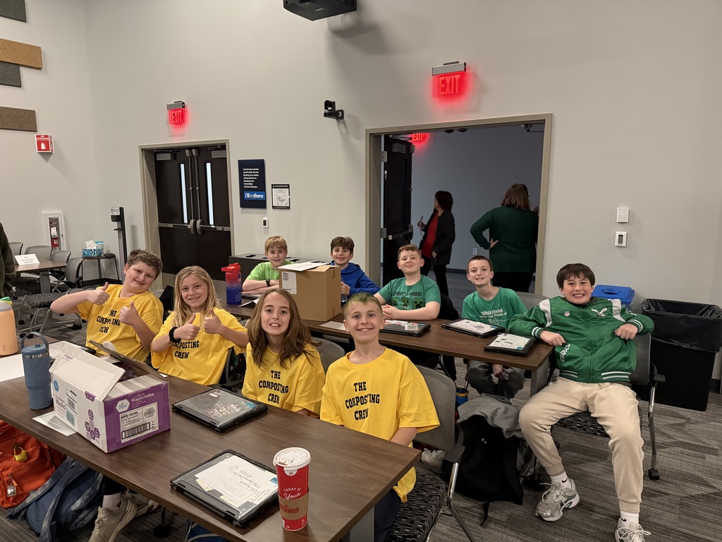students sitting at table ready to compete