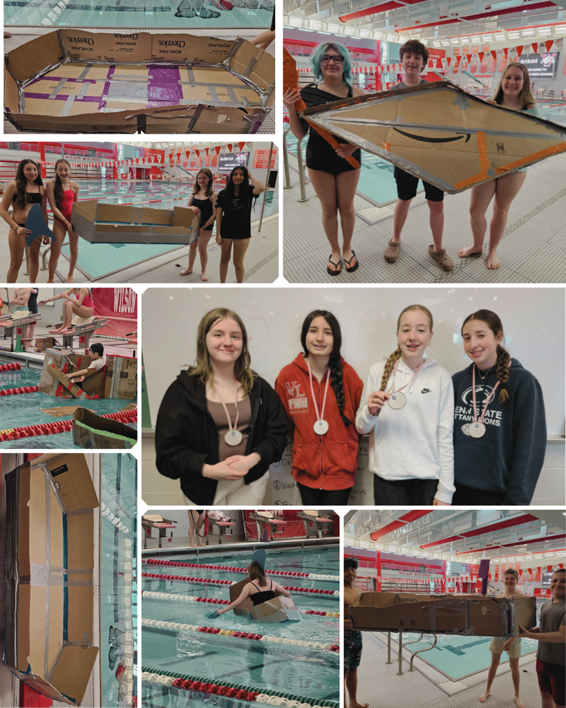 students in the water with homeade boats