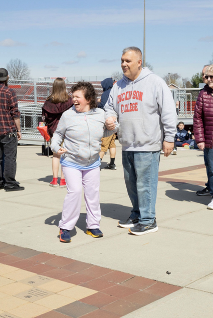 student with teacher at the event