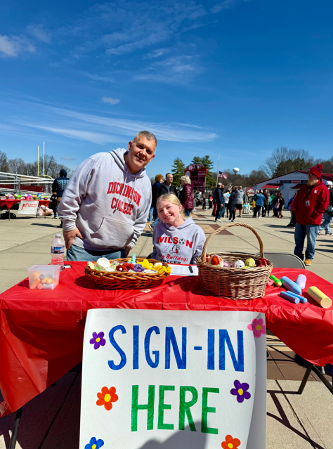 student and teacher at the sign up table
