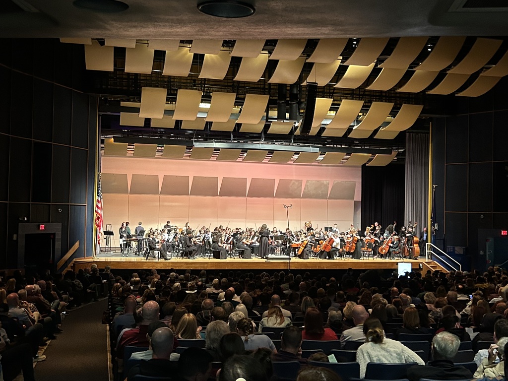 students performing on stage