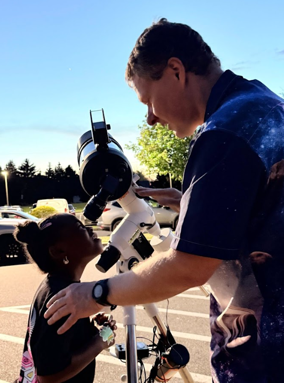 student looking into the sky