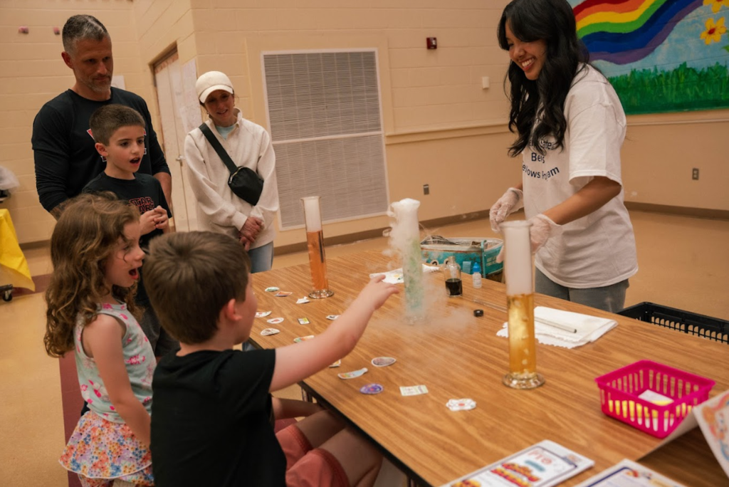 students getting excited about science experiment