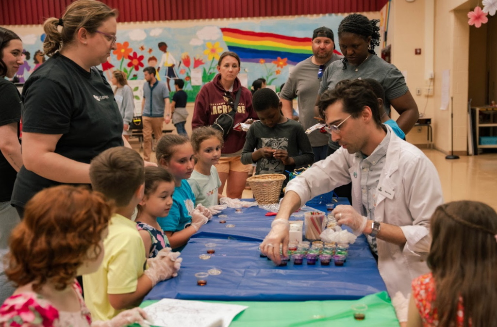 students learning from scientist