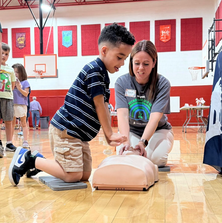 student practicing CPR