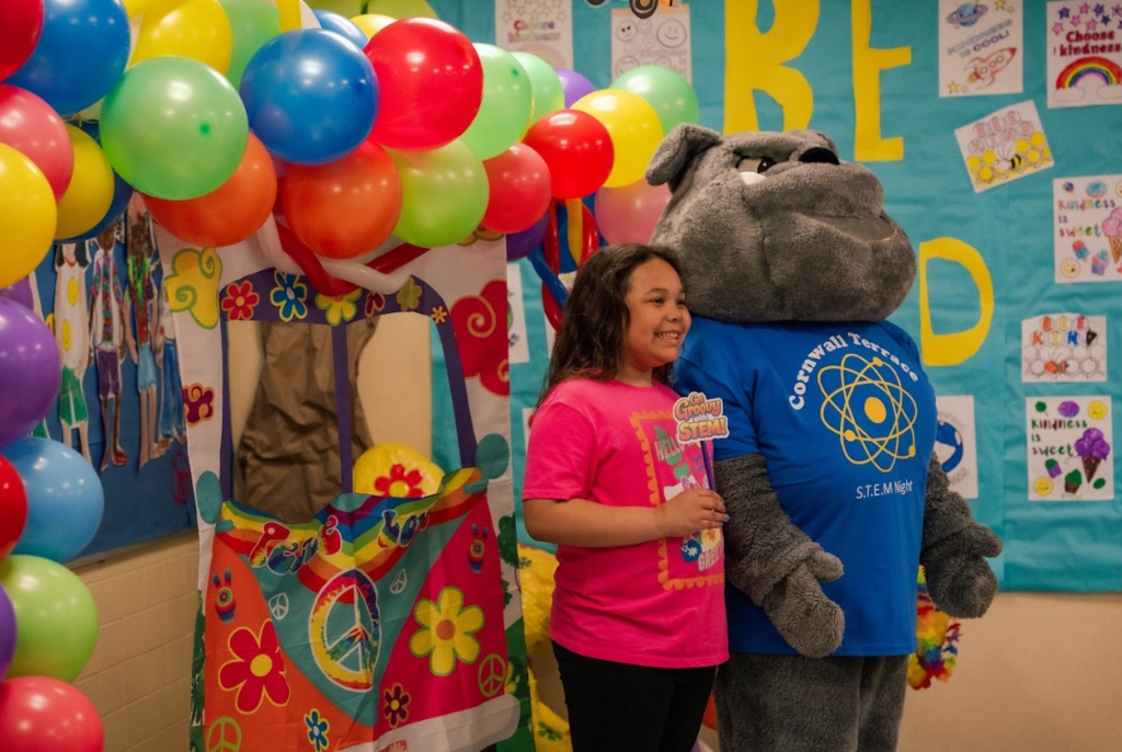 student with Bulldog mascot