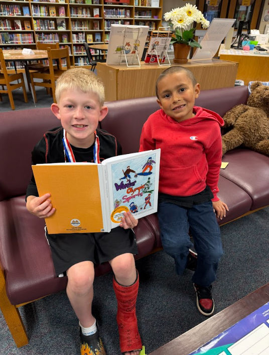 students together reading their book