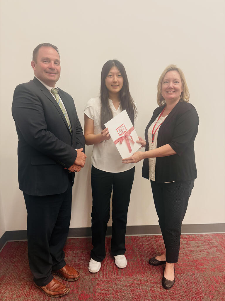 Heidi ding with superintendent and board president