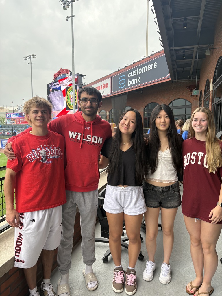 group of students standing on field