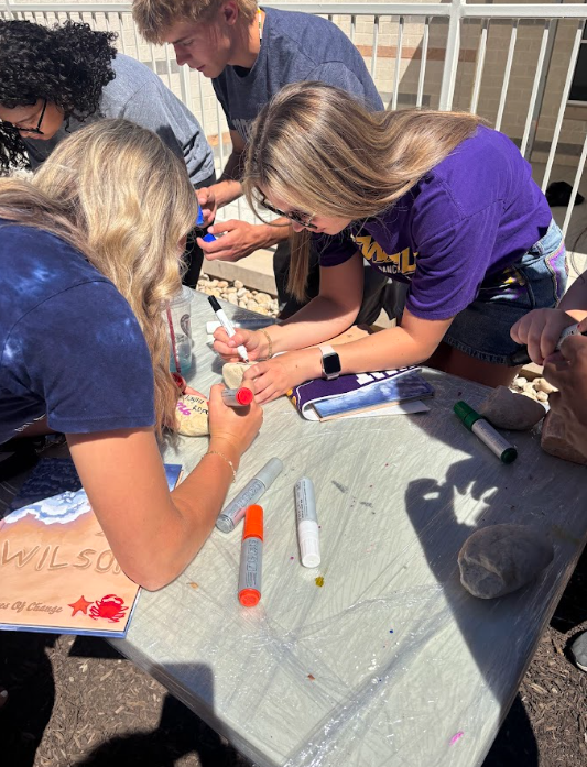 students decorating rocks