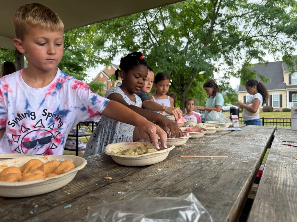 students playing with slime at picnic table