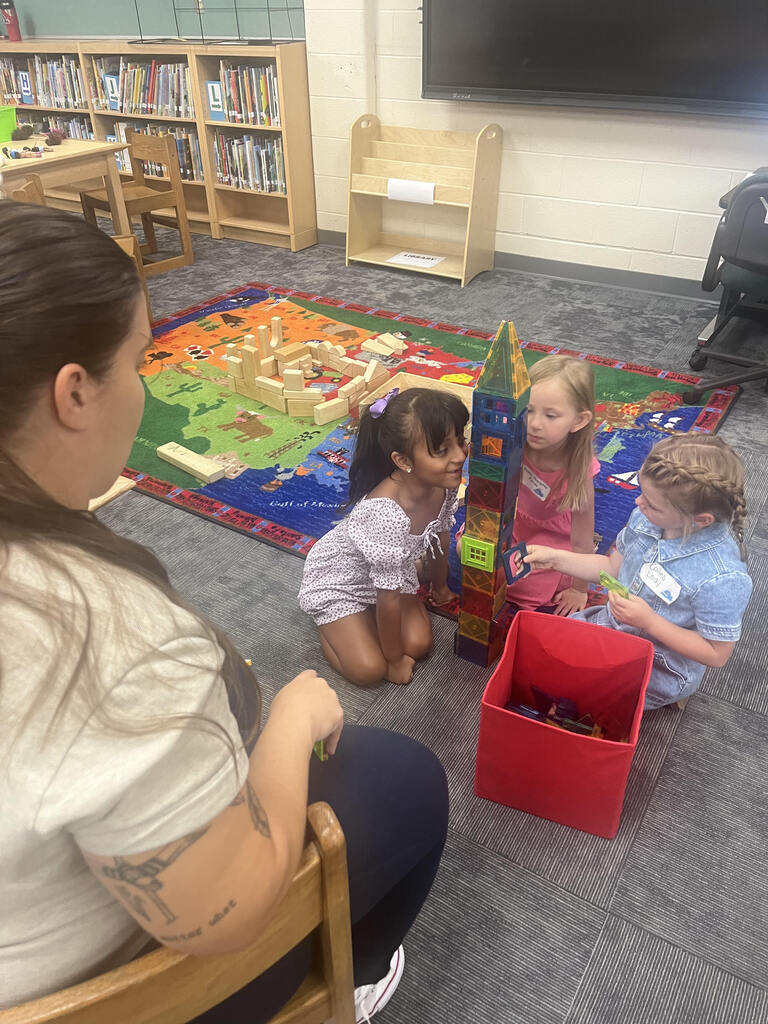 students playing with building blocks