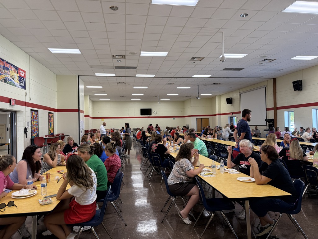 lunch room filled with staff members