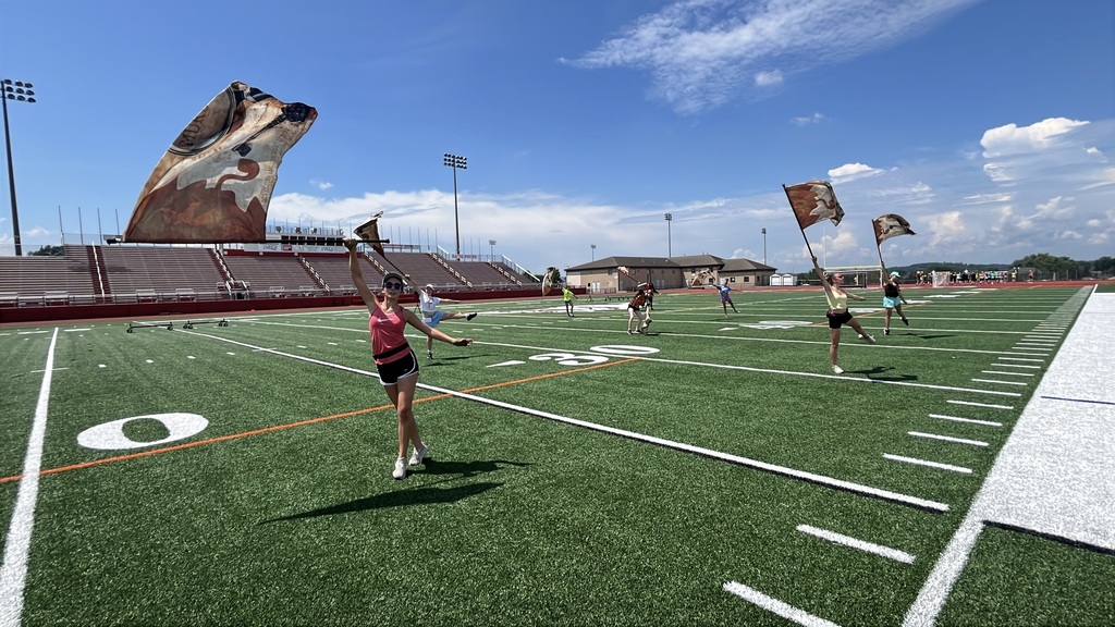 students with flags on the field