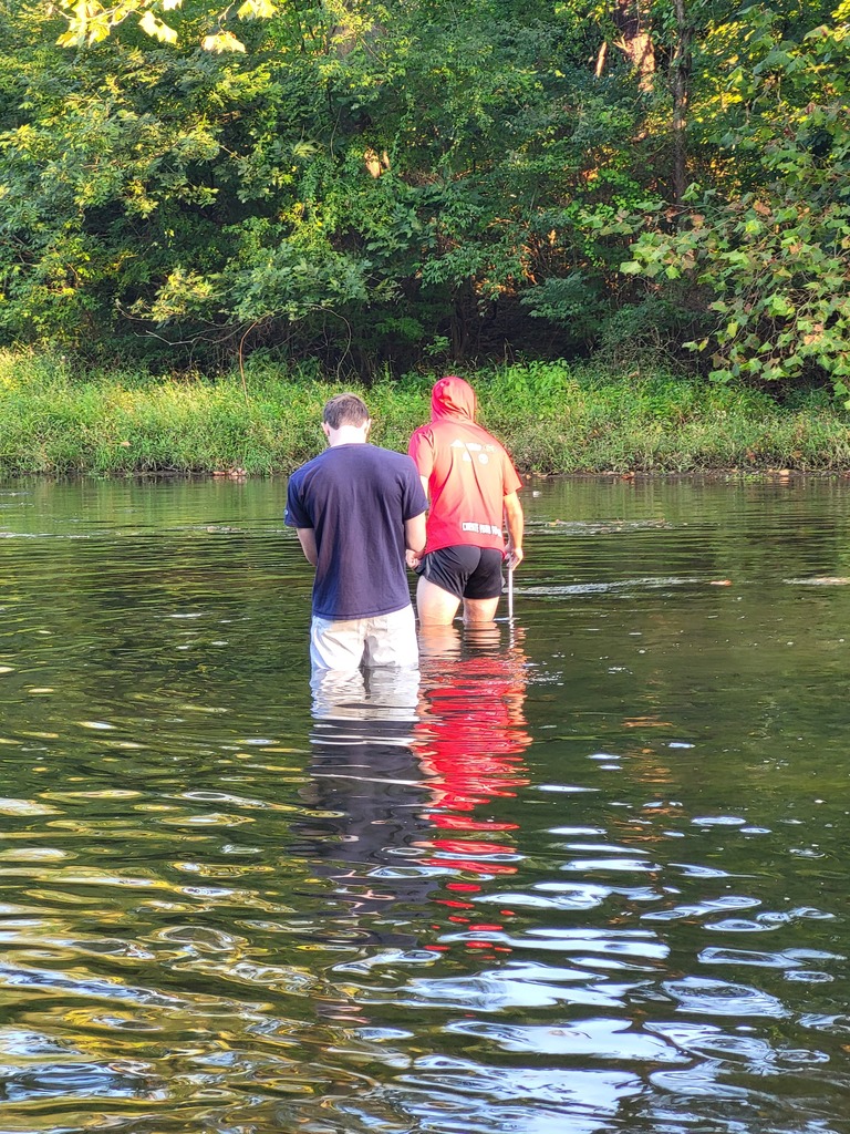 students in creek