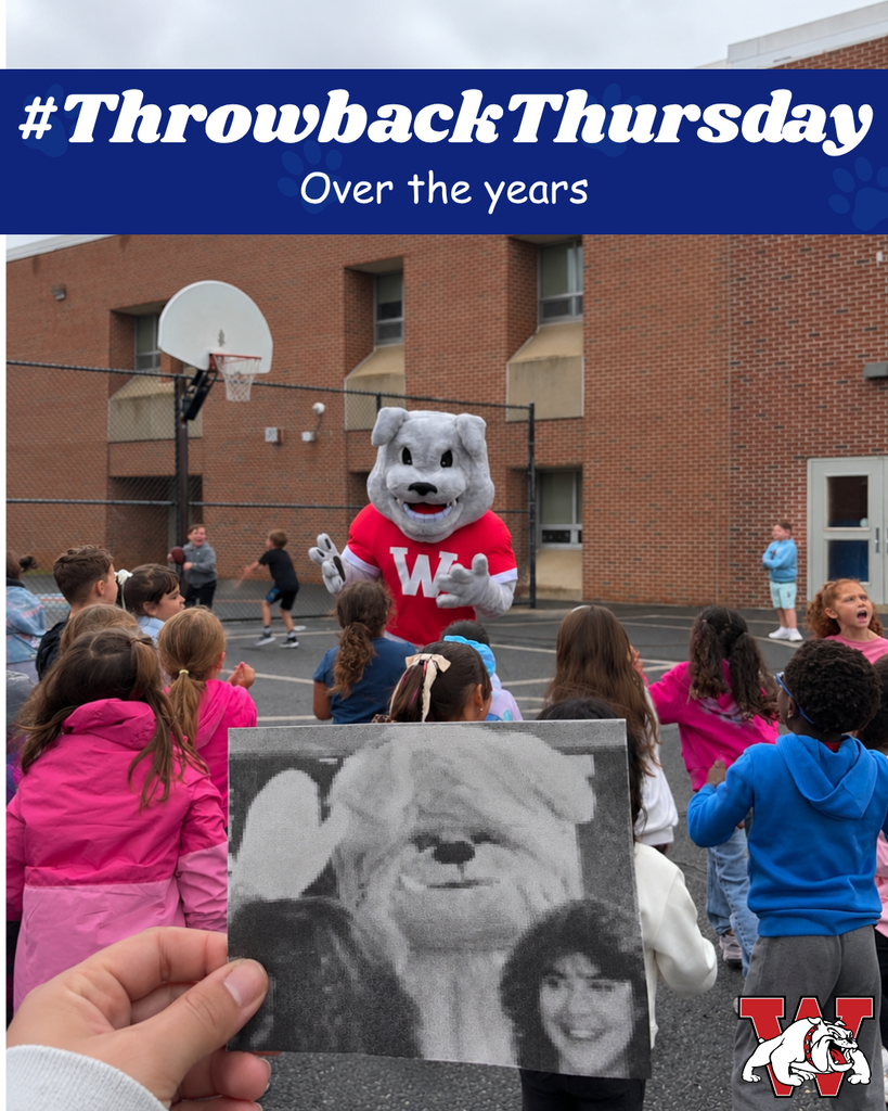 Alt text: A group of elementary school students gather outside around the new Wilson Bulldog mascot, who is wearing a red Wilson shirt. In the foreground, someone holds a black-and-white photo of the former Bulldog mascot and students from years ago, creating a then-and-now comparison. The graphic reads “#ThrowbackThursday” and “Over the years,” with a Wilson logo in the bottom right.