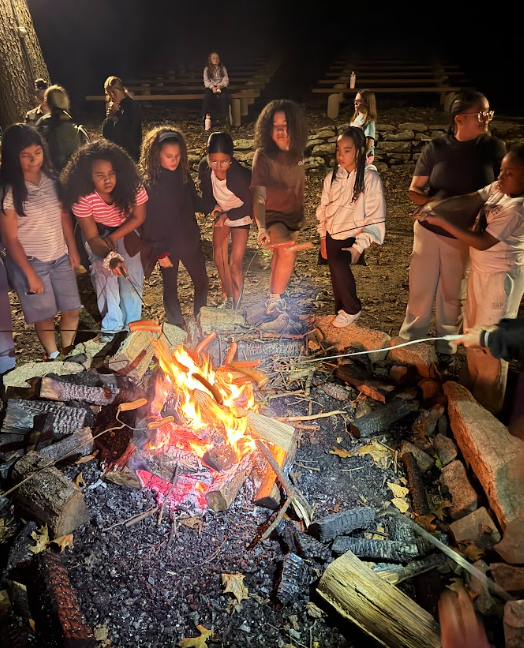 students around a campfire